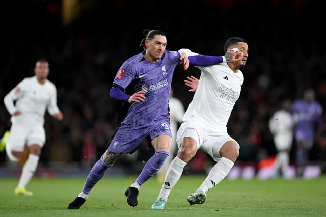 Darwin Nunez of Liverpool and William Saliba of Arsenal battle off the ball