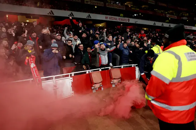 Liverpool fans celebrate their team's first goal