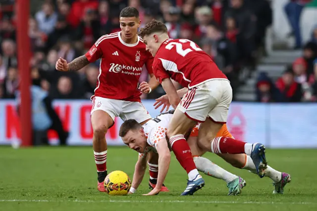 Andy Lyons fights for the ball with  Nicolas Dominguez and  Ryan Yates