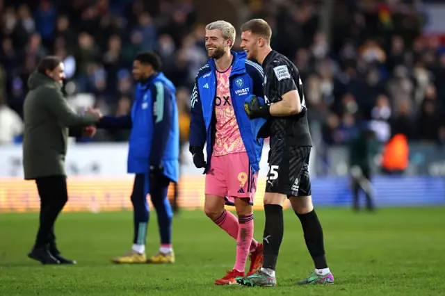 Patrick Bamford of Leeds United speaks with Fynn Talley of Peterborough United