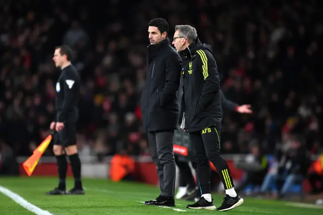 Albert Stuivenberg, Assistant Manager of Arsenal, speaks with Mikel Arteta