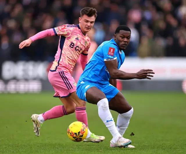 Ephron Mason-Clark of Peterborough United and Jamie Shackleton battle for the ball