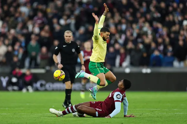 Nahki Wells jumps over West Ham United's English defender Ben Johnson