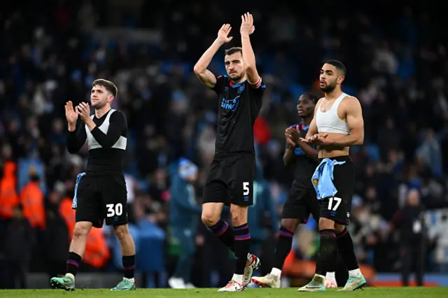 Michal Helik of Huddersfield Town applauds the fans