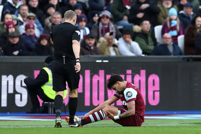 : Lucas Paqueta of West Ham United reacts holding his leg