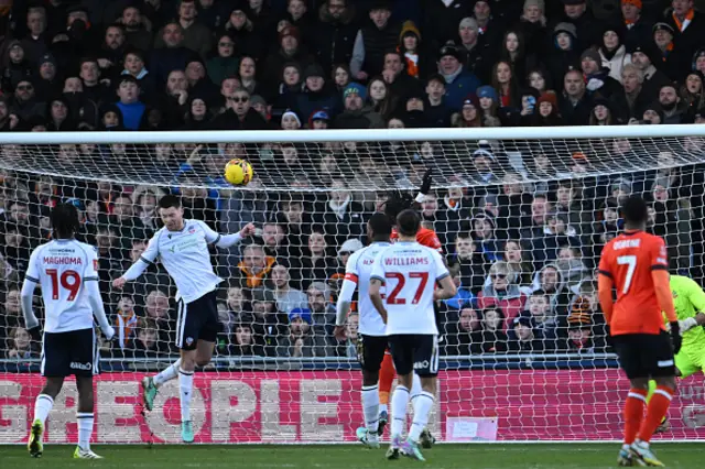 Bolton Wanderers' English defender Will Forrester heads the ball off the line