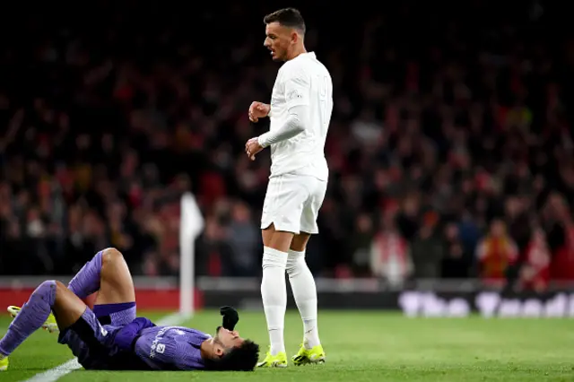 Ben White of Arsenal looks on following a successful tackle on Luis Diaz