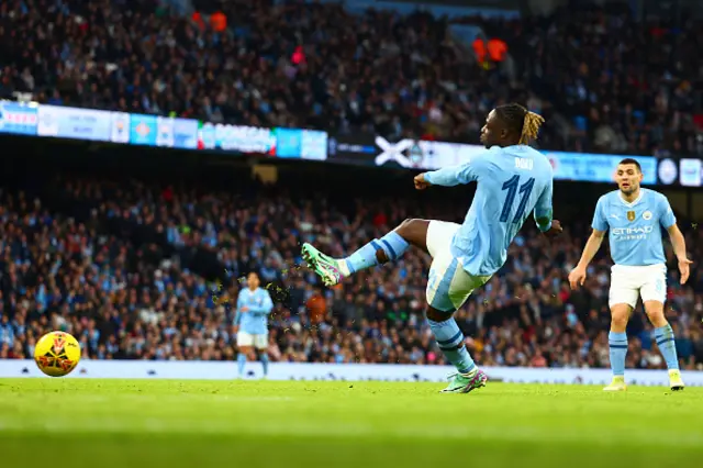 Jeremy Doku of Manchester City scores