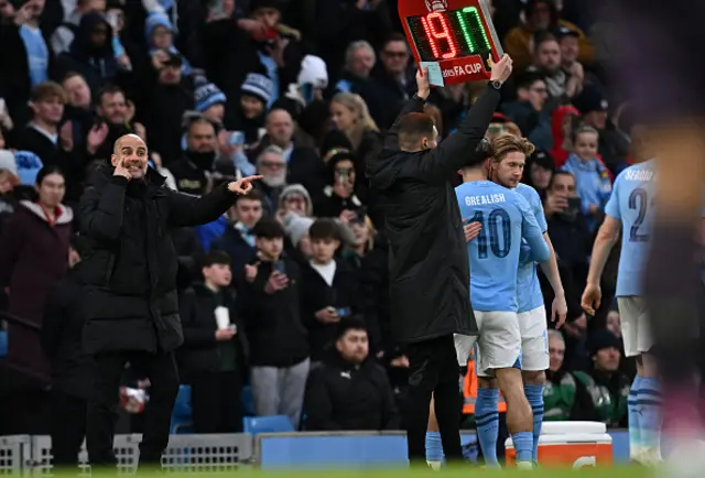 Pep Guardiola gestures on the touchline while Kevin De Bruyne is substituted on