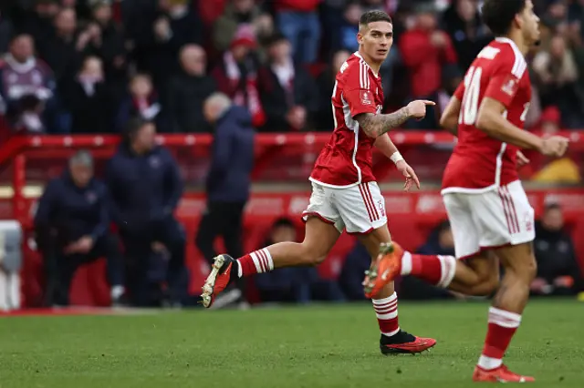 Nicolás Domínguez runs back to his own half after scoring