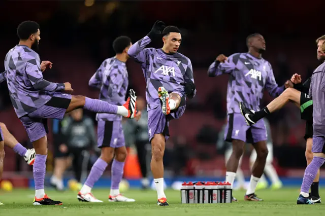 Trent Alexander-Arnold of Liverpool warms up alongside teammates