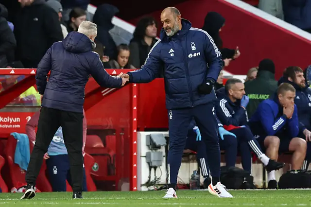 Neil Critchley shakes hands with Nottingham Forest's Portuguese manager Nuno Espirito Santo