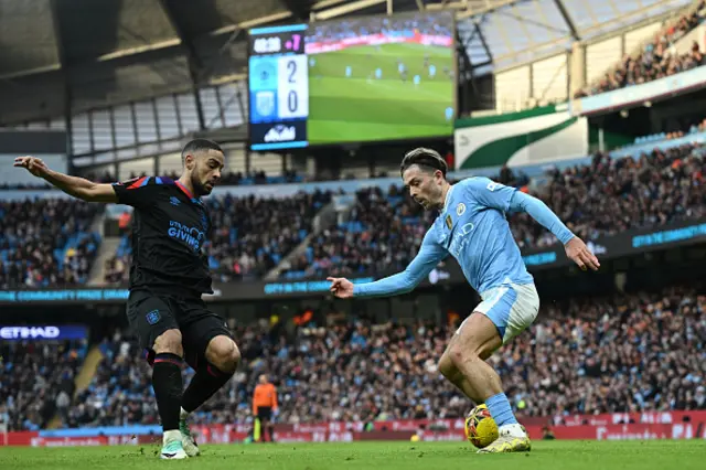 Brodie Spencer vies with Manchester City's English midfielder Jack Grealish