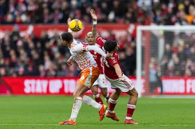 Morgan Gibbs-White of Nottingham Forest is challenged by Oliver Norburn