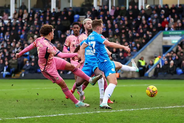 Ethan Ampadu takes a shot at goal as Collins attempts to block it