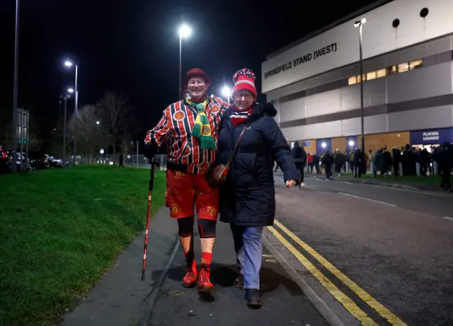 Manchester United fans are seen outside the stadium before the match against Wigan in the FA Cup third round