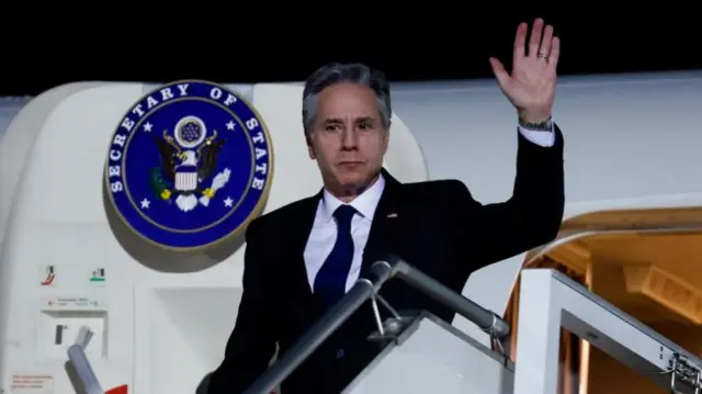 Description U.S. Secretary of State Antony Blinken gets off a plane after arriving in Abu Dhabi