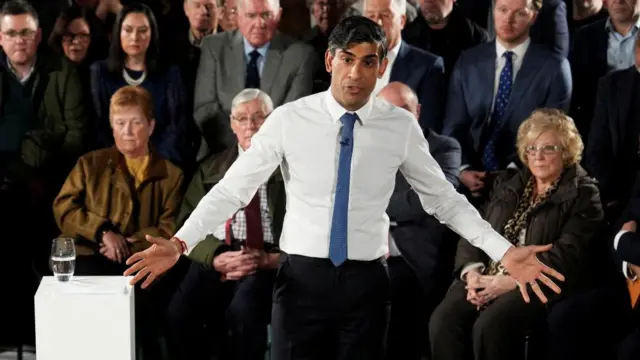 British Prime Minister Rishi Sunak talks to an audience at PM Connect event