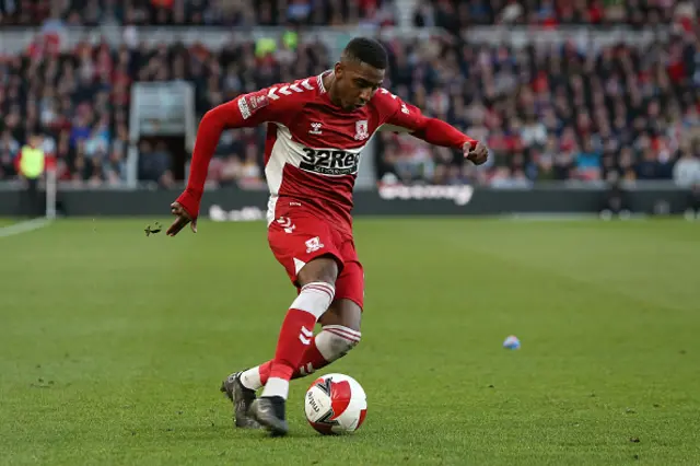 Isaiah Jones crosses the ball in