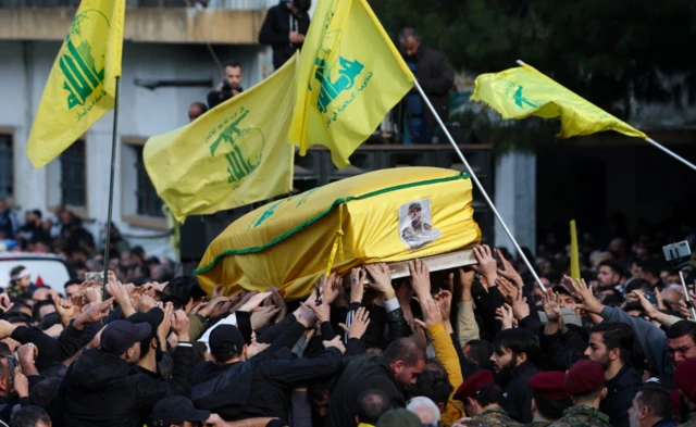 Mourners carry a coffin during the funeral of Wissam Tawil, a commander of Hezbollah’s elite Radwan forces who according to Lebanese security sources was killed during an Israeli strike on south Lebanon, in Khirbet Selm