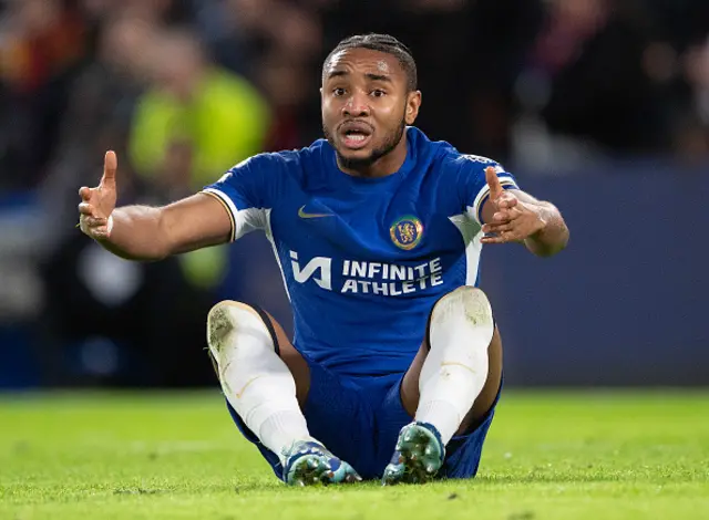 Christopher Nkunku of Chelsea sits on the floor during a game