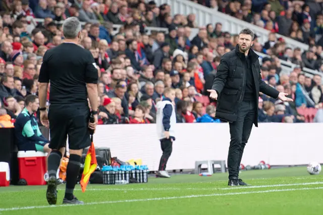 Michael Carrick looks amazed as a foul is not given