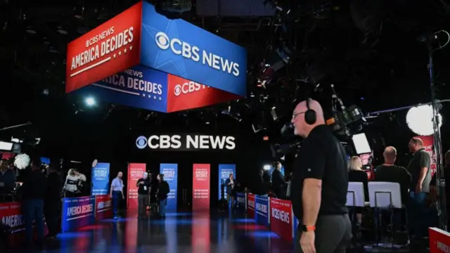 CBS crew members prepare the VP debate spin room