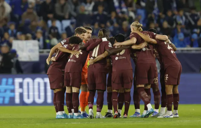 City players huddle before kick off