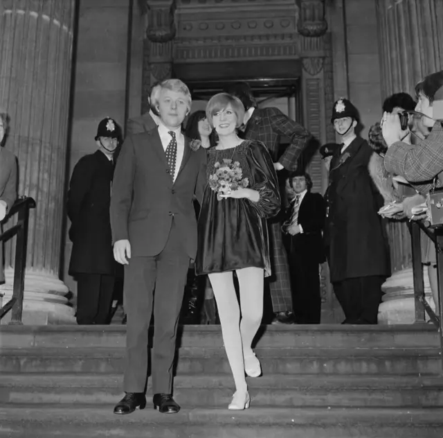 Pop star Cilla Black and her personal manager Bobby Willis on the steps of the town hall