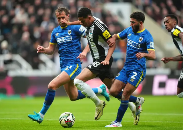 Joe Lewis, William Osula, Huseyin Biler battle for the ball