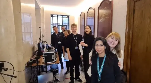 The BBC team smiling in a corridor at Old Marylebone Town Hall