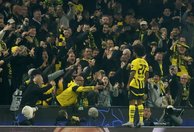 Adeyemi celebrates his goal with the home fans