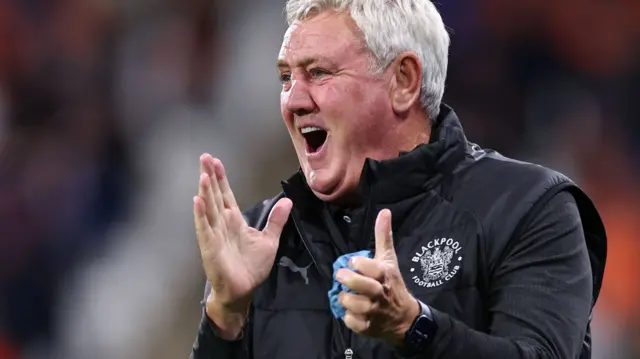 Blackpool head coach Steve Bruce applauds