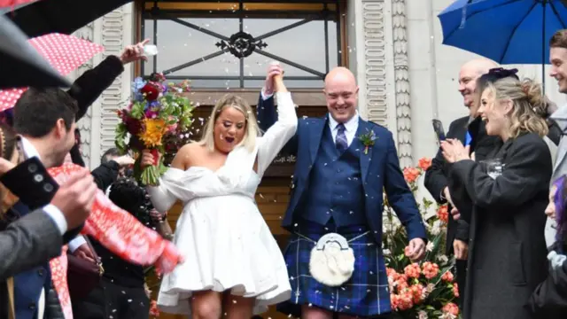 Thomas Mackintosh and Paige after wedding at Old Marylebone Town Hall