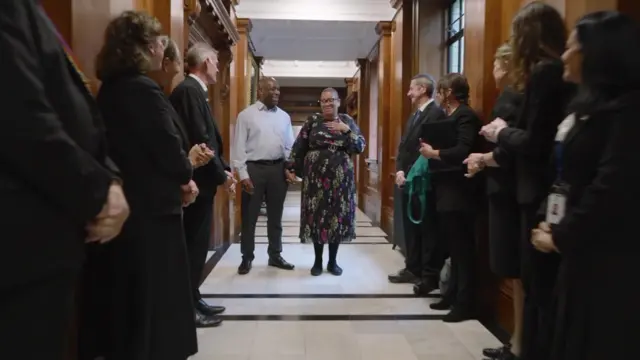 Employees lined up in the halls of the Old Marylebone Town Hall to celebrate their former colleague Joyce renewing vows with her husband Kunle.