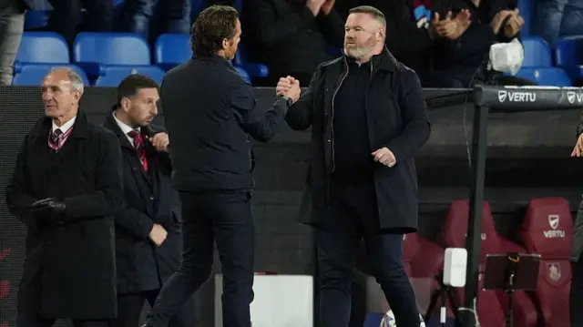 Scott Parker and Wayne Rooney embrace at full-time