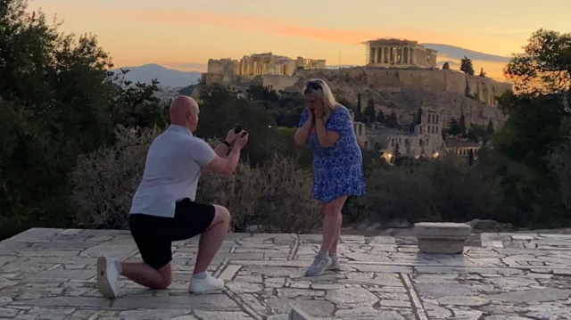 Thomas and Paige as Thomas is on one knee proposing