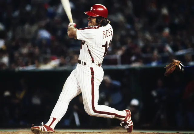 Pete Rose hitting a ball during the 1980s World Series