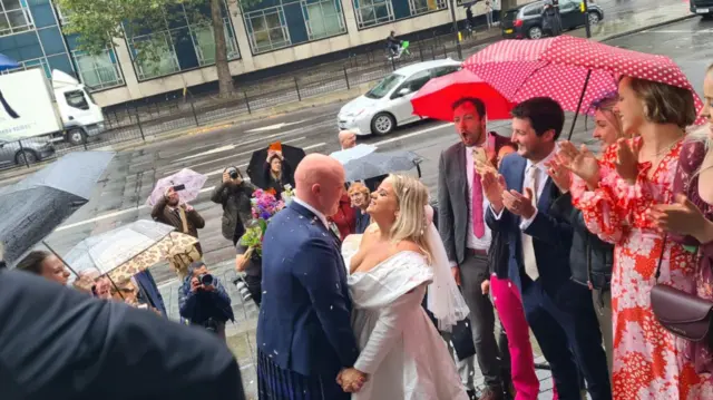 Tom and Paige on the steps of the town hall