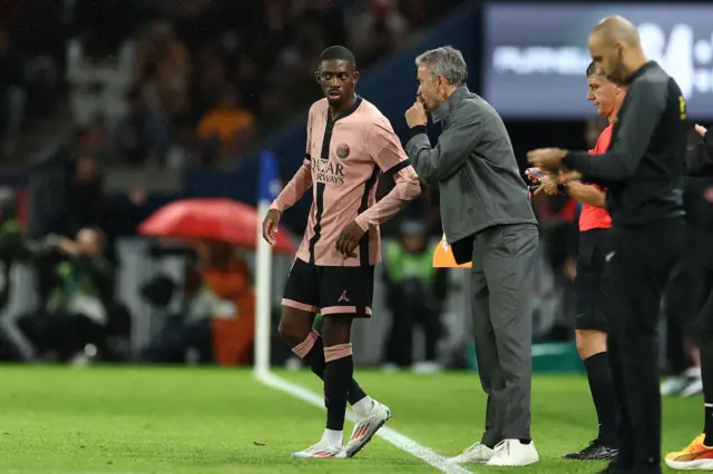 Luis Enrique and Ousmane Dembele chat on the touchline