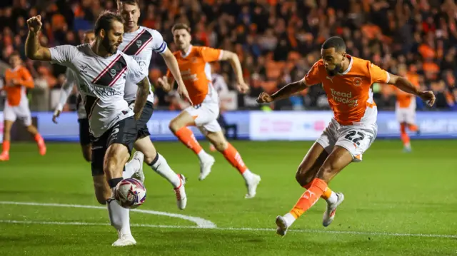 Blackpool take a shot at goal against Lincoln