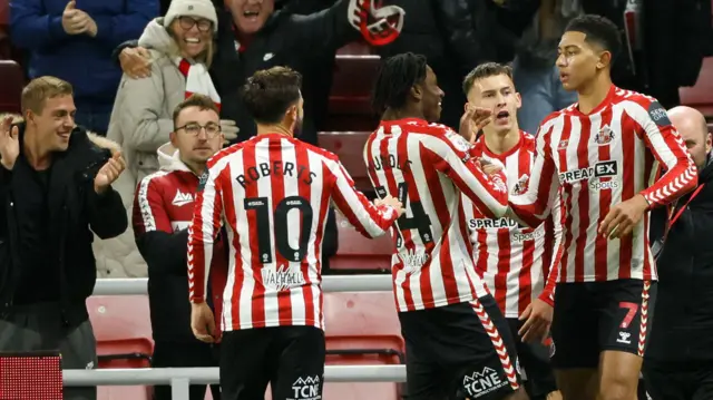 Joe Bellingham celebrates his goal against Derby with his Sunderland teammates