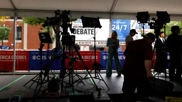 Camera crews setting up outside the CBS Broadcast Center