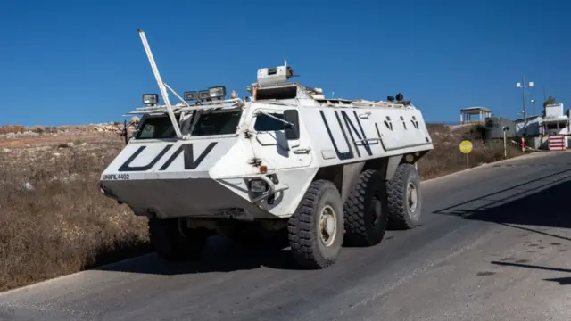 A Unifil armoured personnel carrier departs a base to patrol near the Lebanon- Israel border on 5 October in Marjayoun, Lebanon