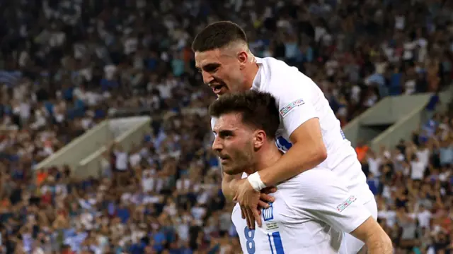 Fotis Ioannidis celebrates with Christos Zafeiris after scoring for Greece against Finland