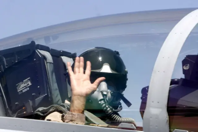 Ratan Tata boarding a Boeing fighter F/A-18 Super Hornet at the Aero India 2011 at the Yelahanka air base