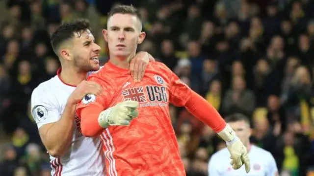 George Baldock and Dean Henderson celebrate while playing for Sheffield United