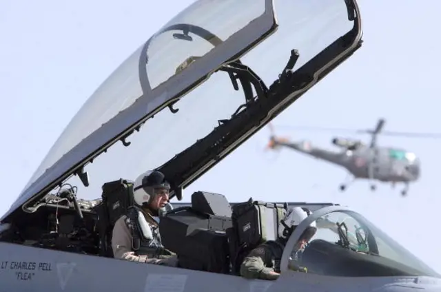 Ratan Tata (L) sits in the co-pilot seat of a US made F-18 aircraft ahead of a flight during the third day of the Aero India 2007 air show at the Air Force Station, Yelahanka