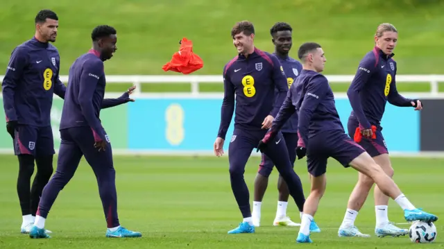 John Stones smiles during England training