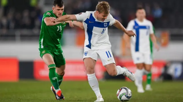 Republic of Ireland's Jason Knight puts pressure on Rasmus Schüller in Helsinki